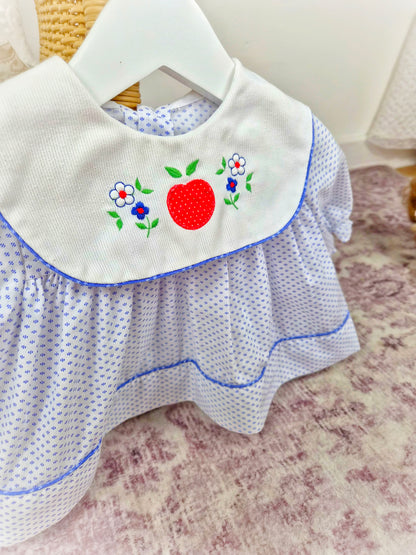 0-6 months. White vintage dress with blue patterns and trim, large white bib and embroidered fruit and flowers