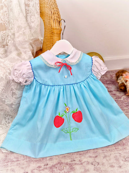 12 months. Blue vintage dress with white puff sleeves and collar and strawberry applique. See description*