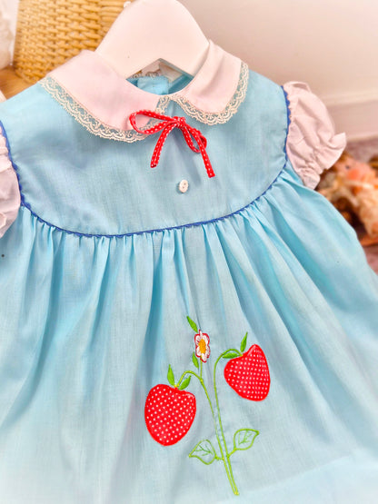 12 months. Blue vintage dress with white puff sleeves and collar and strawberry applique. See description*
