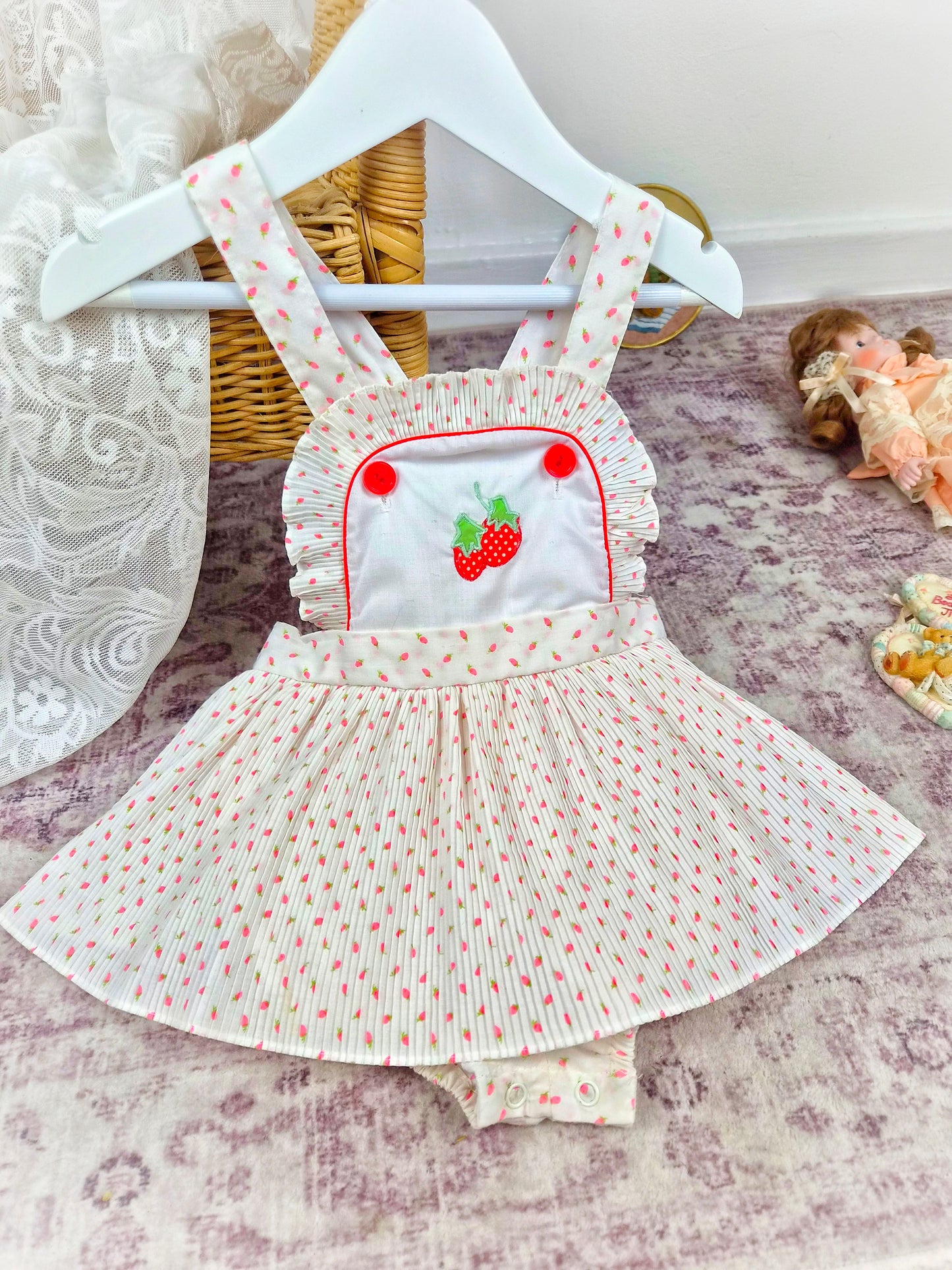 18 months. White vintage skirted romper with mini pleats and strawberry print