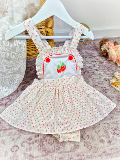 18 months. White vintage skirted romper with mini pleats and strawberry print