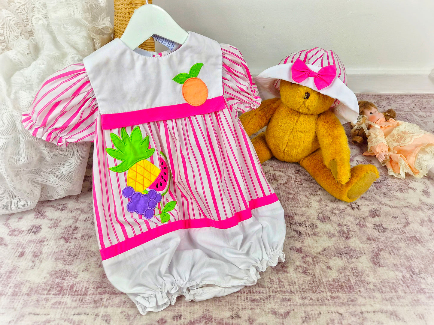 2 years. Vintage romper and matching hat from Nannette, white and hot pink stripes with fruit appliques