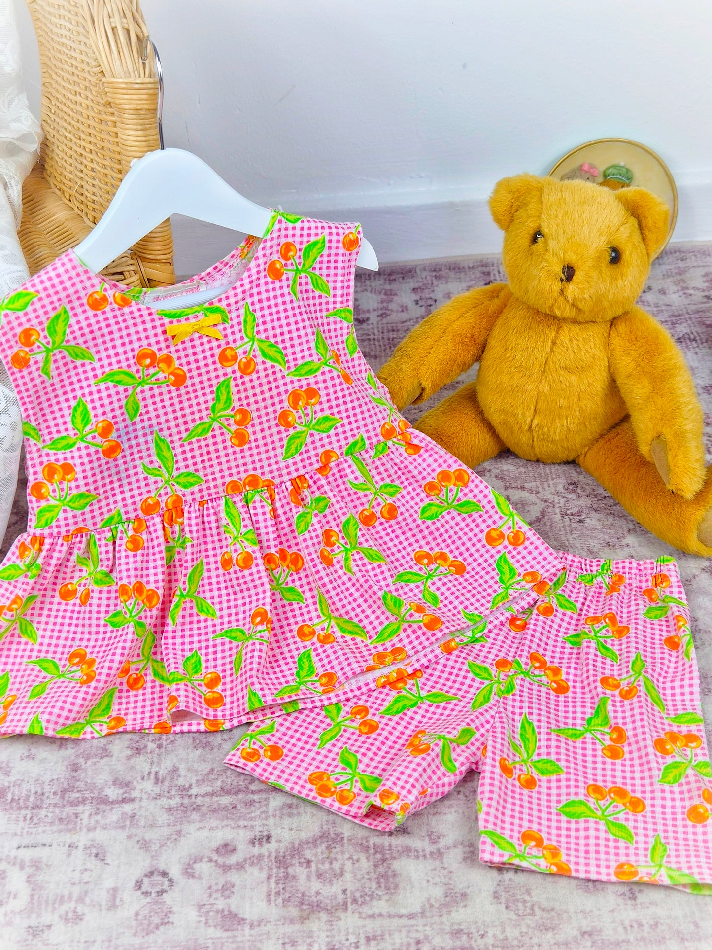 2-3 years. Vintage two piece set, sleeveless tunic with shorts. Pink and white gingham with green leaves and orange berries