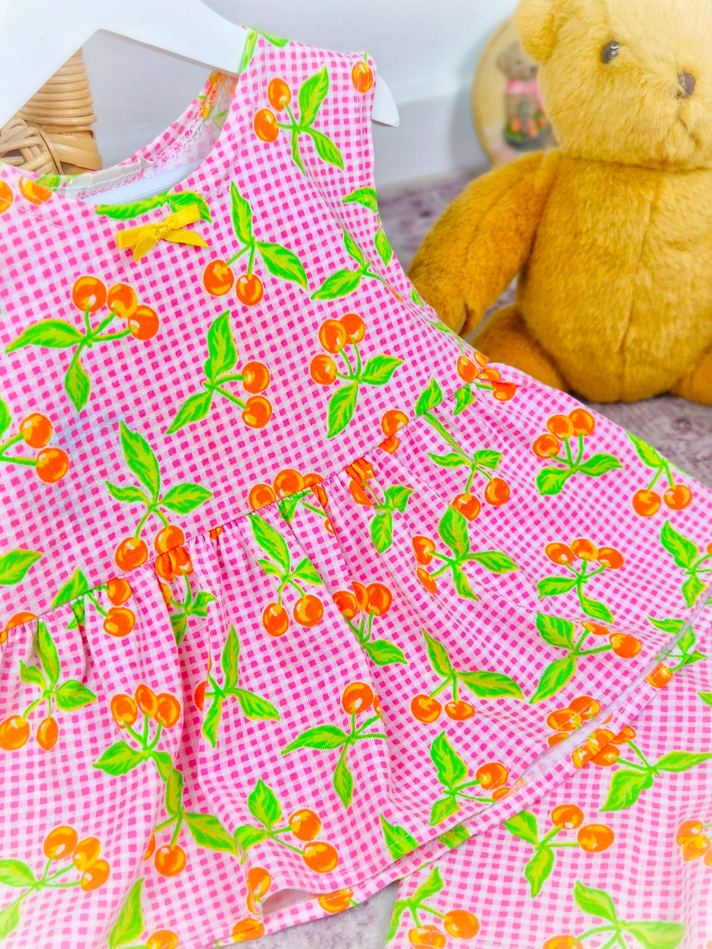 2-3 years. Vintage two piece set, sleeveless tunic with shorts. Pink and white gingham with green leaves and orange berries