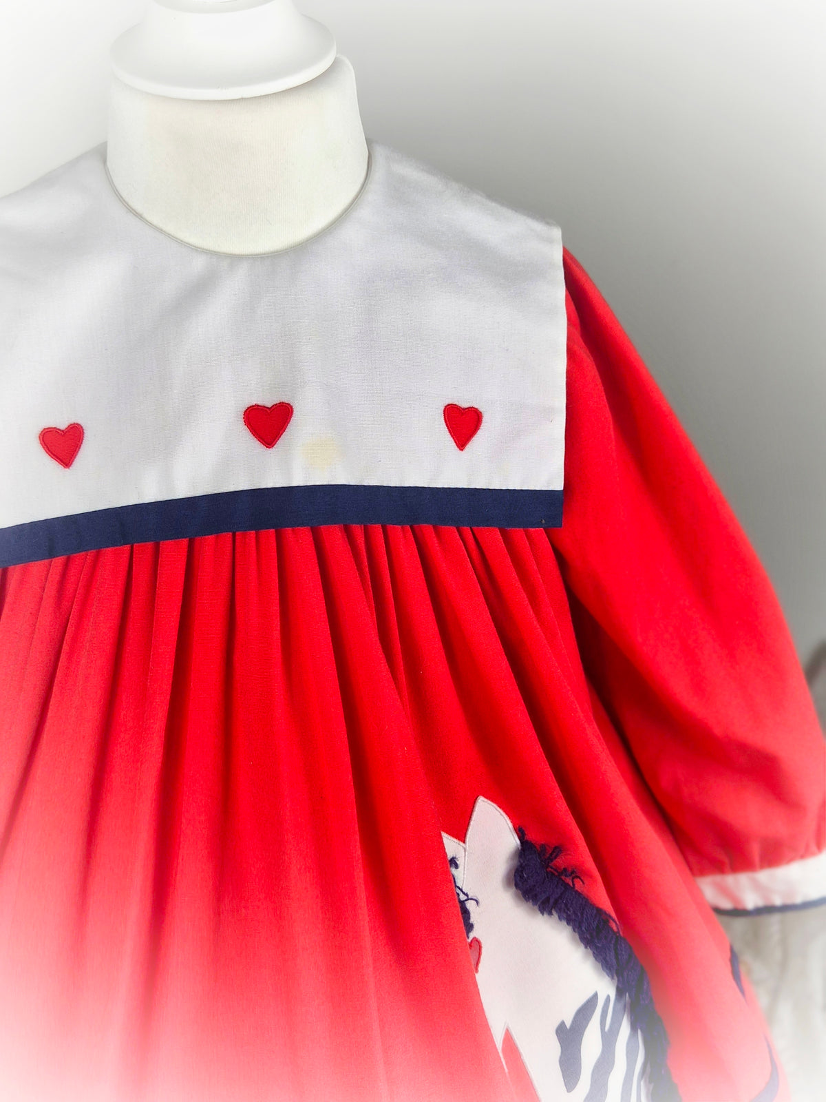 2-3 years. Red vintage Nannette dress with white bib and zebra applique