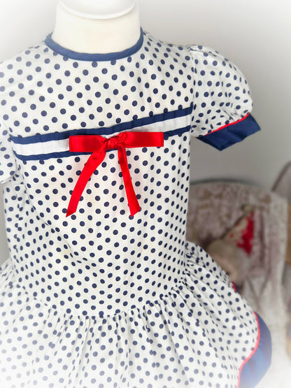 3 years. White vintage dropwaist Roanna dress with navy polka dots a d red ribbon