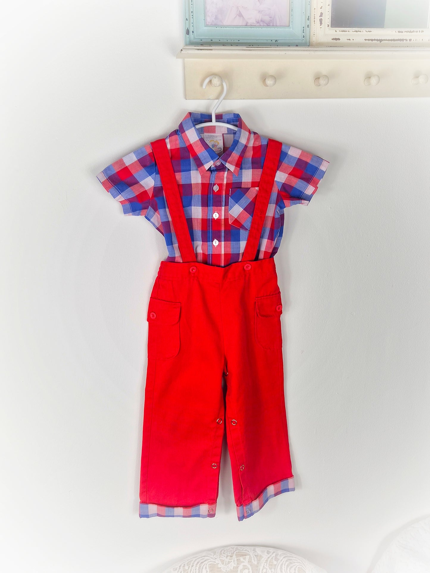 18-24 months. Red, blue and white checked shirt with matching red overalls by Joyeux Gamins