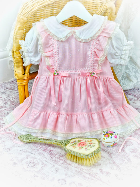 12-18 months. Pink and white vintage dress from Toddle Time, flutter shoulders, puff sleeves, lace and ribbon