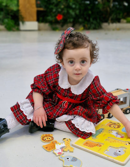 2 years. Red tartan dress with white collar embroidered with dainty flowers. Ribbon belt.