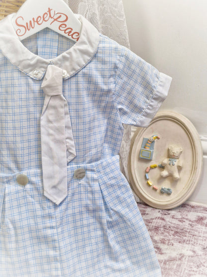 Best fit 12-18 months. Two piece shirt and shorts set. Blue and white checkered