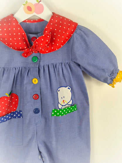 12 months. Vintage romper with red polka dot collar, primary coloured buttons & apple and teddy bear appliques