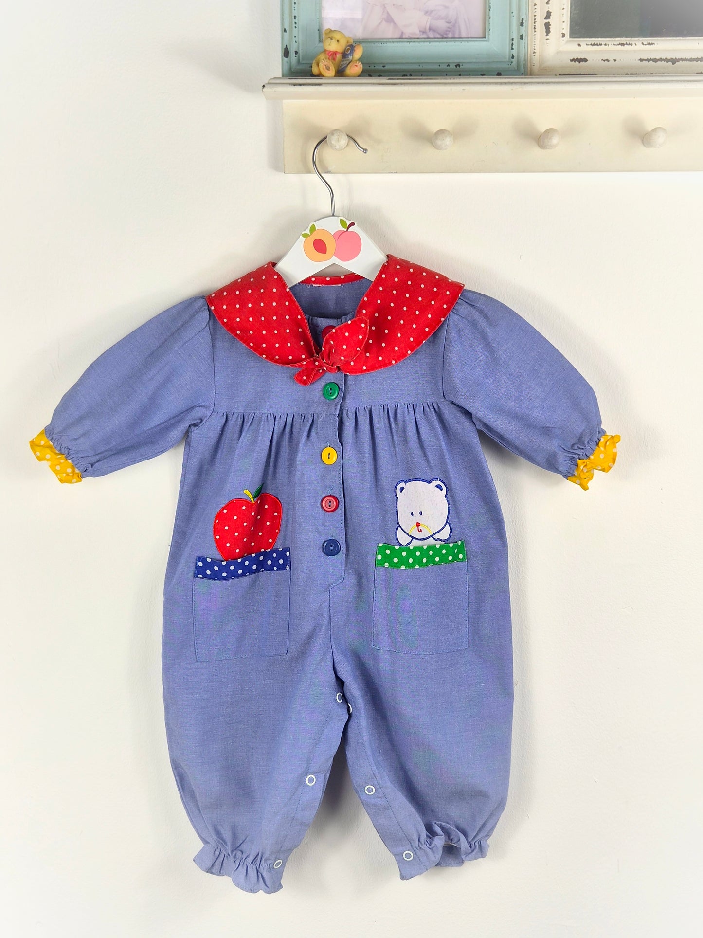 12 months. Vintage romper with red polka dot collar, primary coloured buttons & apple and teddy bear appliques