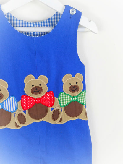 2-3 years.  Blue sleeveless vintage dungarees with 3 teddies wearing bow ties
