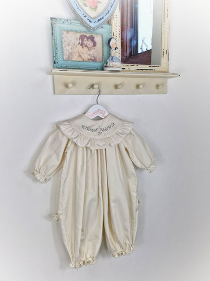 9-12 months Heather Brown romper. Cream with frilly, embroidered bib