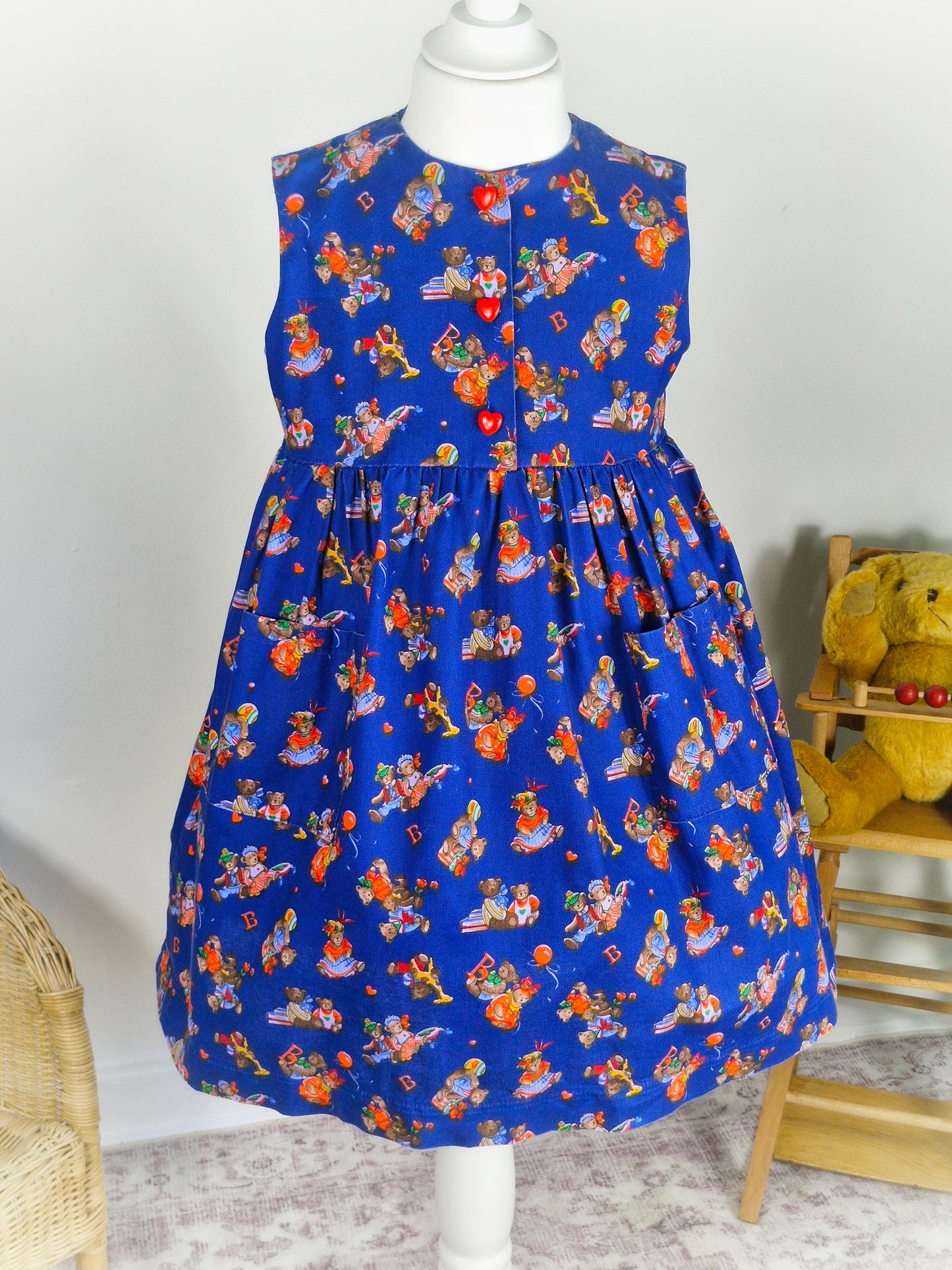 5 years. Navy vintage sleeveless dress with teddy bear print and red heart buttons