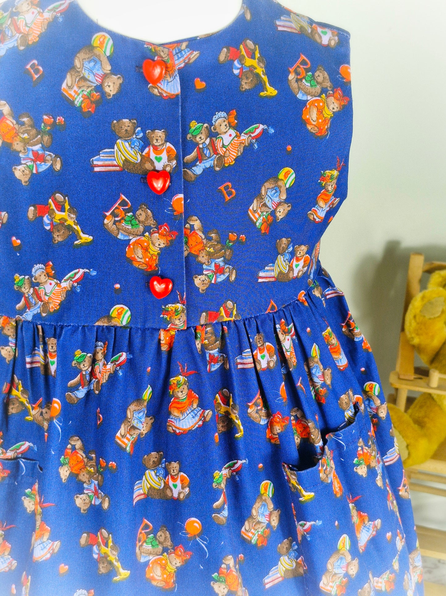 5 years. Navy vintage sleeveless dress with teddy bear print and red heart buttons