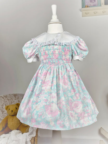 3-4 years. Pink and blue pastel smock vintage dress with puff sleeves, white collar and lace trim