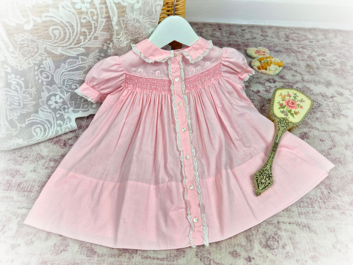 12-18 months. Vintage pink smock dress, embroidered by hand.