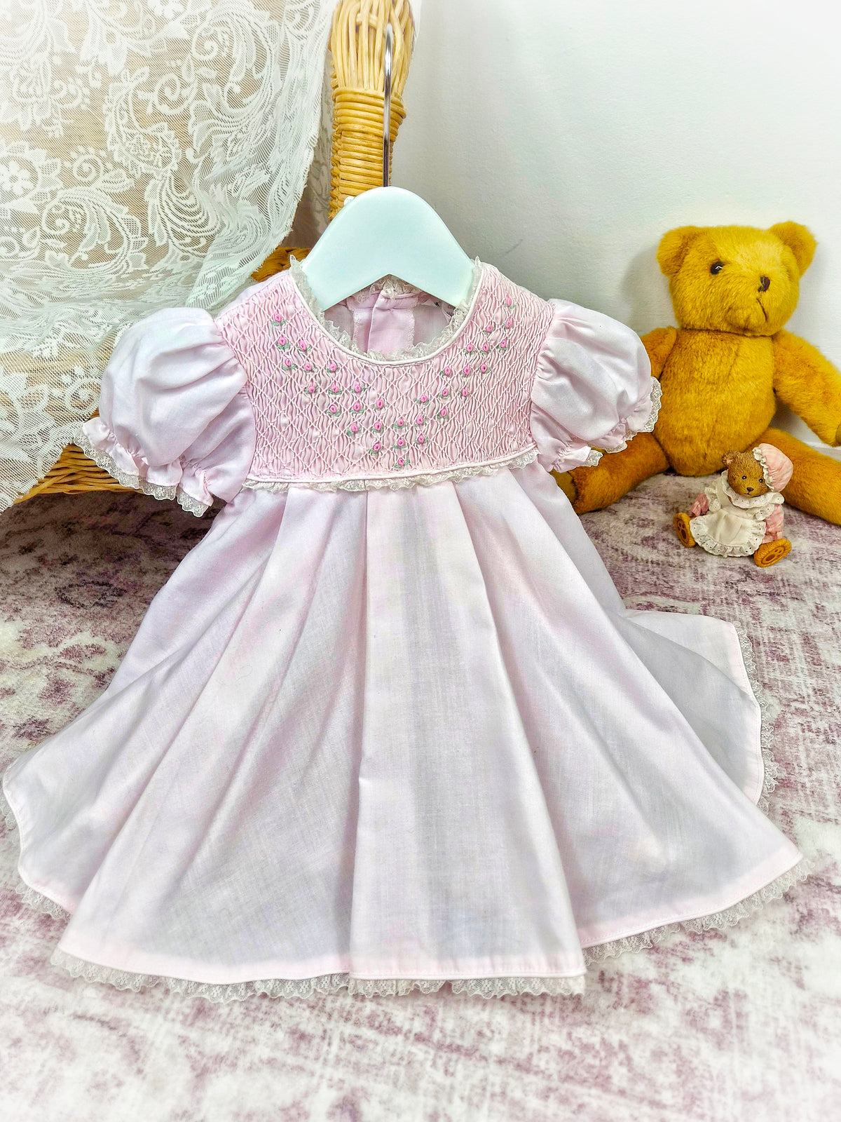 9-12 months. Pink vintage smock dress embroidered with dainty flowers. Small faults*