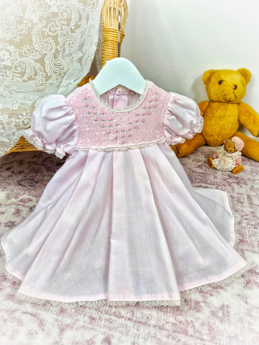 9-12 months. Pink vintage smock dress embroidered with dainty flowers. Small faults*