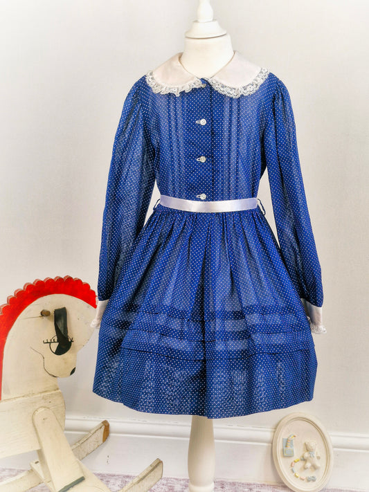 Navy dress with white polka dots, collar and lace. Best fit 6-7 years