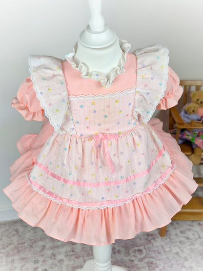 2 years. Pink vintage dress with puff sleeves and white apron, colourful butterfly print, satin pink ribbon and flutter shoulders