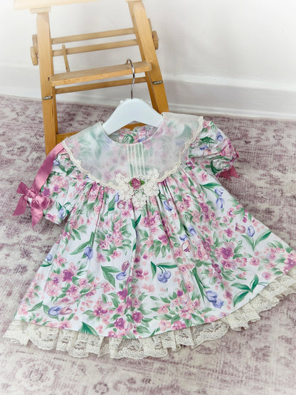 2 years. Floral vintage dress with white bib and pink sating ribbon bows