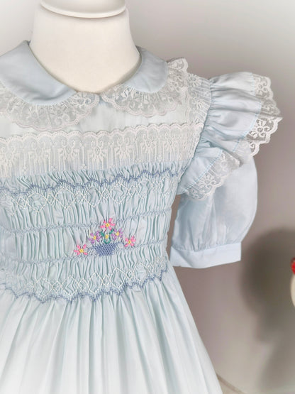 6 years. Blue vintage Polly Flinders smock dress with floral embroidery, lace trim and flutter shoulders