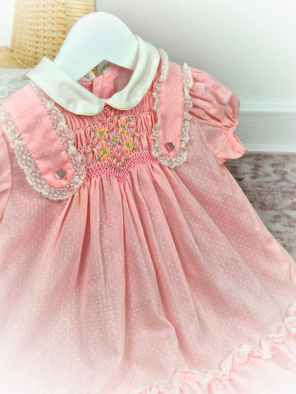 18-24 months. Pink vintage Polly Flinders smock dress wih white collar and polka dots