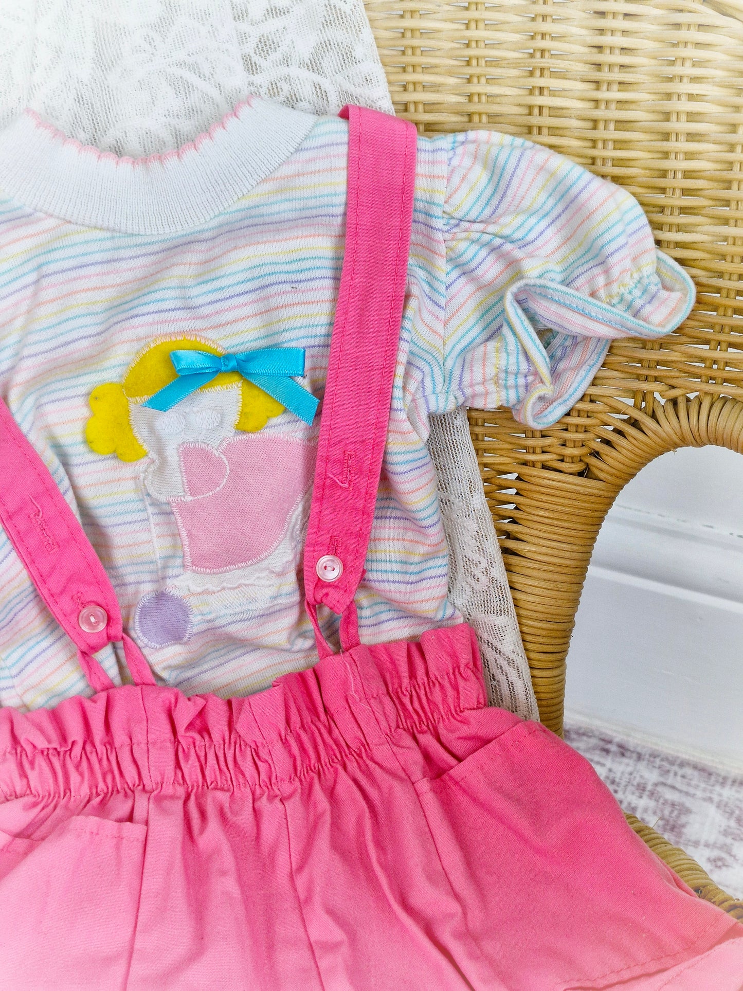Best fit 12-18 months. Pastel striped Tshirt and pink shorts dungarees set