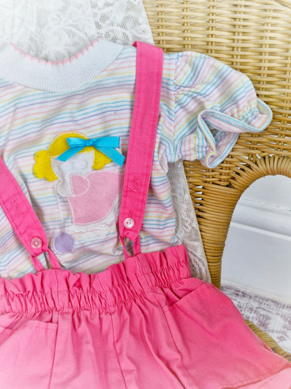 Best fit 12-18 months. Pastel striped Tshirt and pink shorts dungarees set