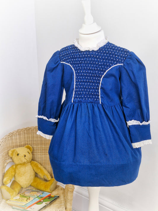 3 years. Navy and white high-neck smock dress