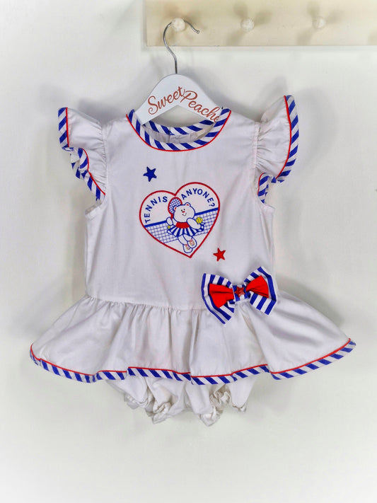 18-24 months. White vintage romper with blue and red details, embroidered teddy bear and "tennis anyone?"