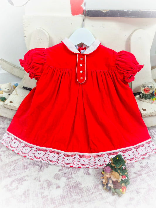 12-18 months. Red vintage velvet dress by Cherubs with white collar, buttons and lace hem