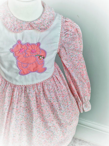 3 years. Pink floral vintage Polly Flinders dress with white bib featuring a bears applique