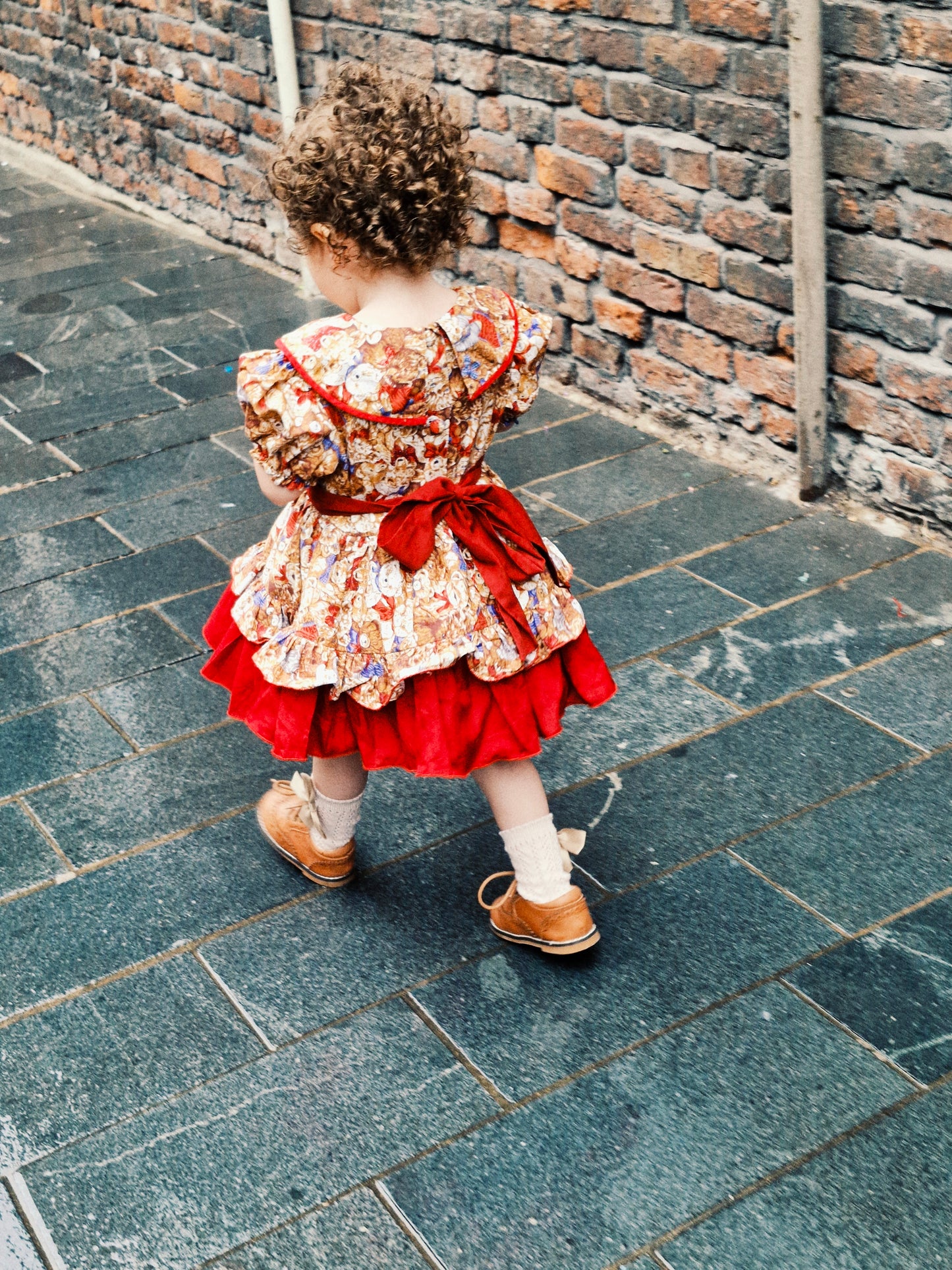 2 years. Handmade in Thailand. Brown bears with maroon finish. Layered skirts