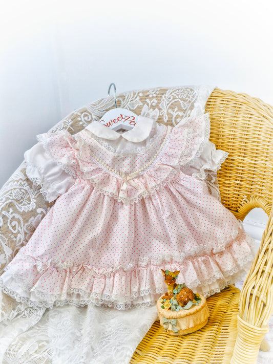 6-9 months. White frilly dress with pink polka dots