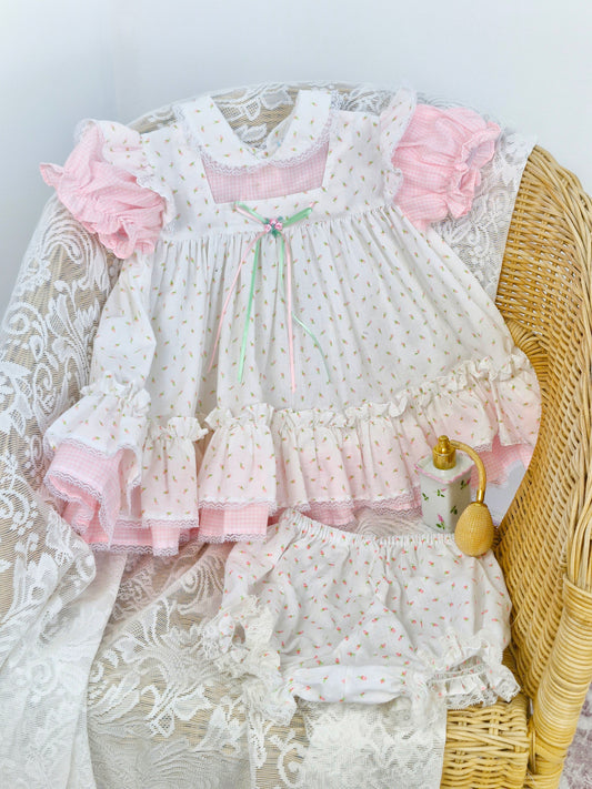 12-18 months two piece set, dress and bloomers. Pink and white gingham dress with apron with floral details.