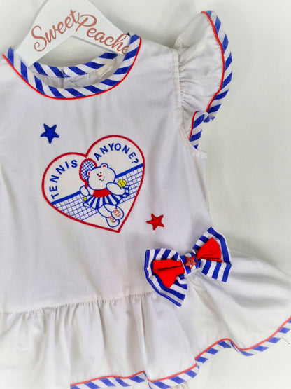 18-24 months. White vintage romper with blue and red details, embroidered teddy bear and "tennis anyone?"