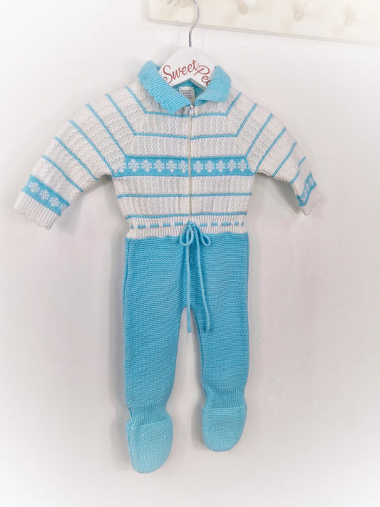 6-9 months. Blue and white knitted romper