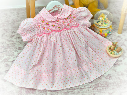 9-12 months. Pink vintage floral smock dress by Baby Togs with embroidered flowers