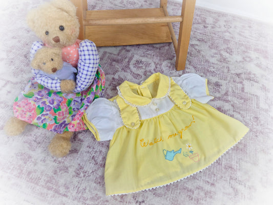 0-3 months. Lemon vintage dress with "watch me grow" embroidered. Small mark*