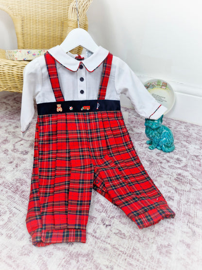 12 months. Red tartan vintage romper, long sleeves, collar and buttons. Embroidered with toys.
