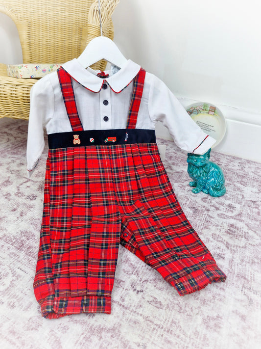 12 months. Red tartan vintage romper, long sleeves, collar and buttons. Embroidered with toys.