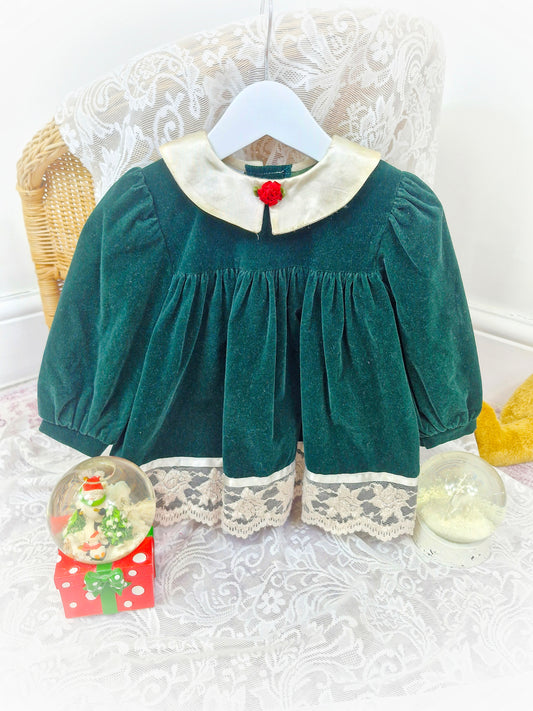 12-18 months. Vintage forest green velvet dress by Jolene, with cream satin collar, cream lace and red floral centre