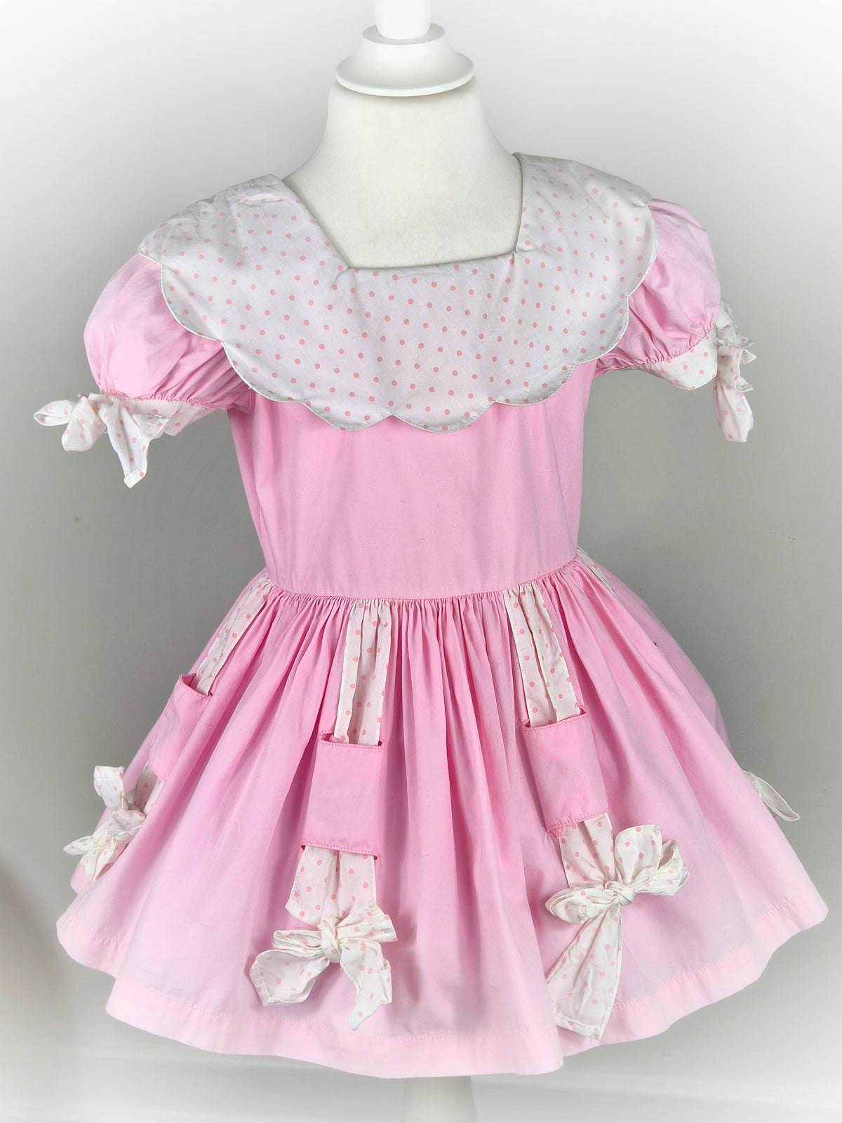 3 years. Pink vintage dress by Cotton Candy with white bib & bows and pink polka dots
