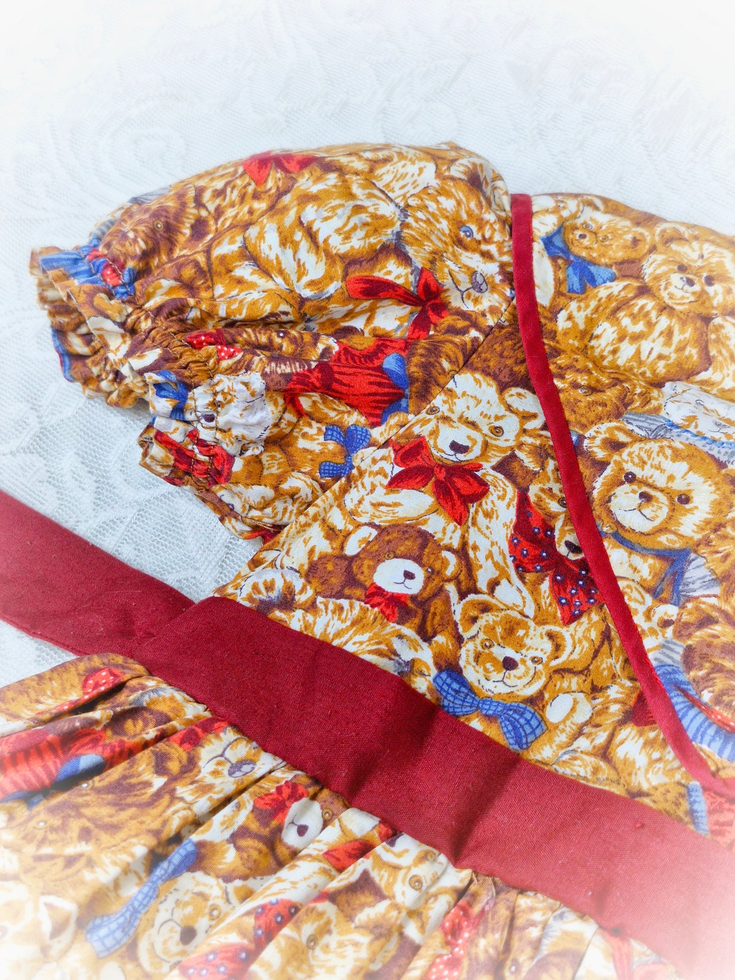 2 years. Handmade in Thailand. Brown bears with maroon finish. Layered skirts