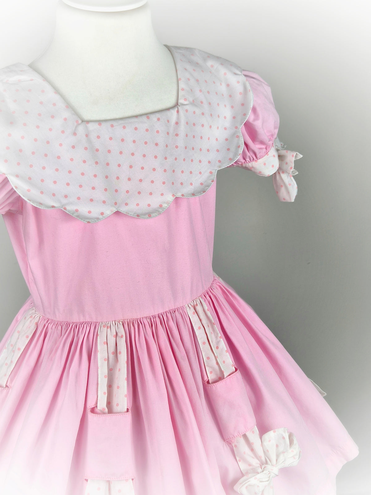 3 years. Pink vintage dress by Cotton Candy with white bib & bows and pink polka dots