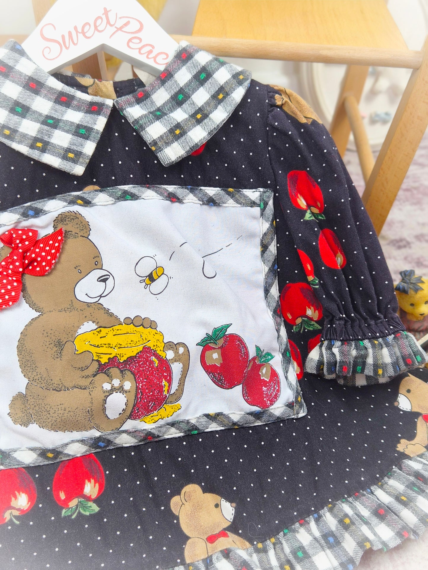 2-3 years. Black vintage top with gingham collar and hem, polka dots, apple print and a teddy bear patch