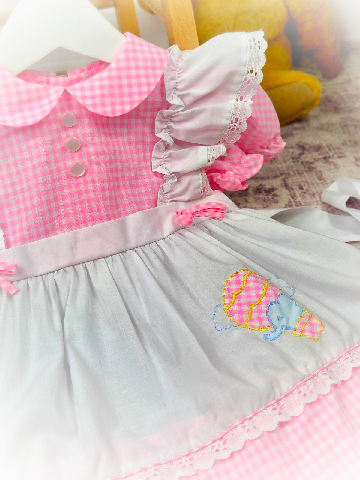 18 months. Pink and white gingham vintage dress with frilly shoulders and cute elephant in a hot air balloon